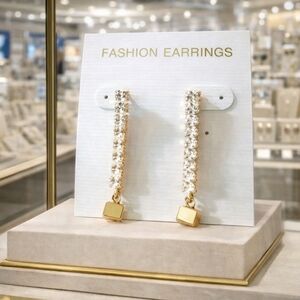 Women's rhinestone and gold earrings